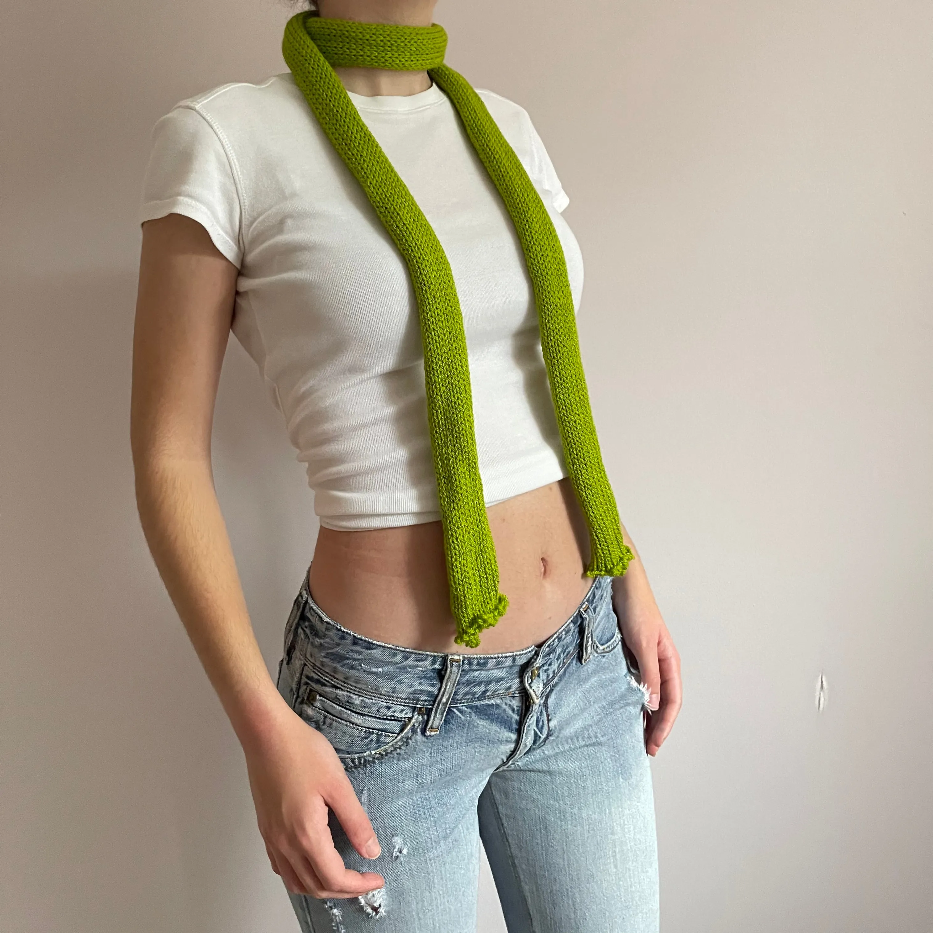 Handmade knitted skinny scarf in olive green