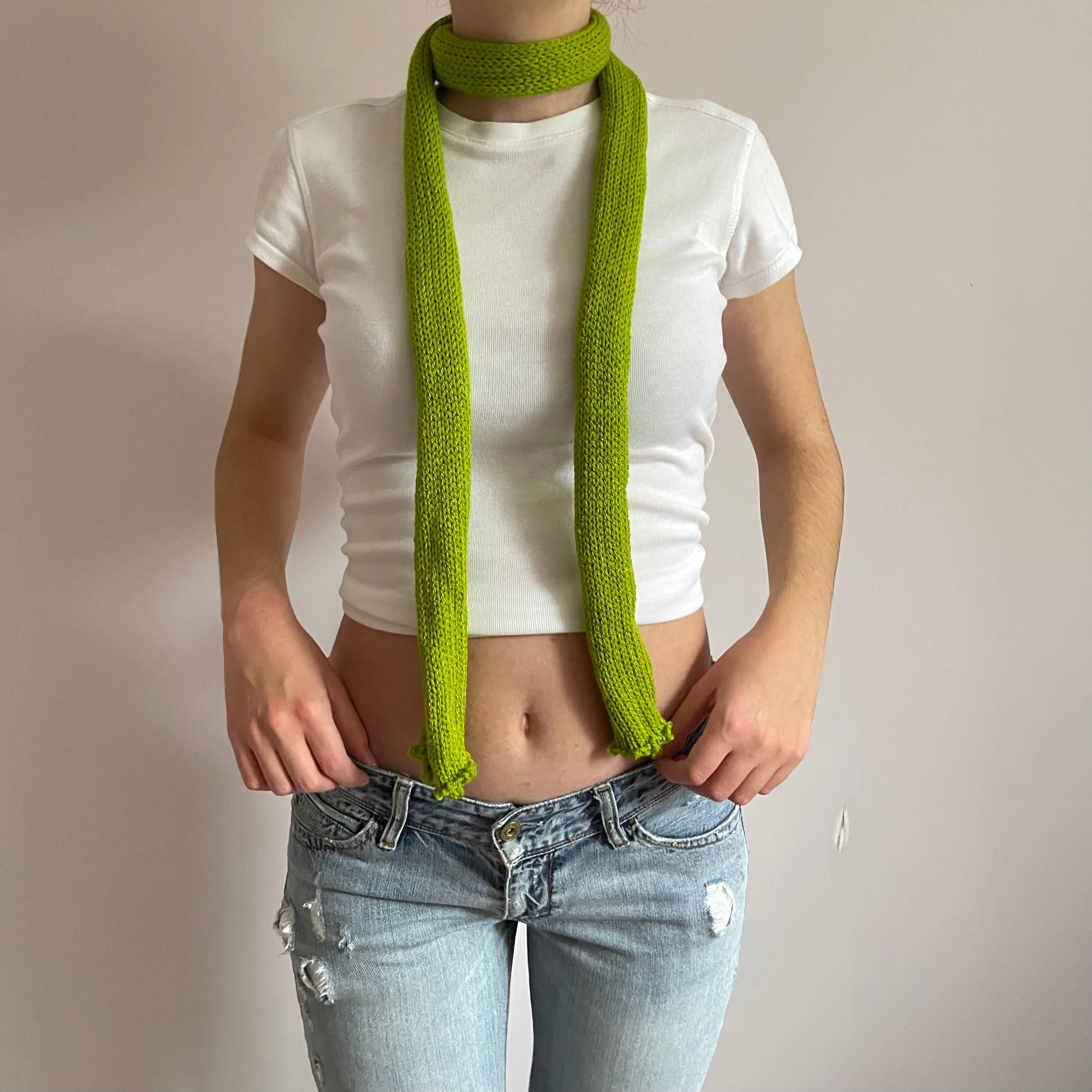 Handmade knitted skinny scarf in olive green