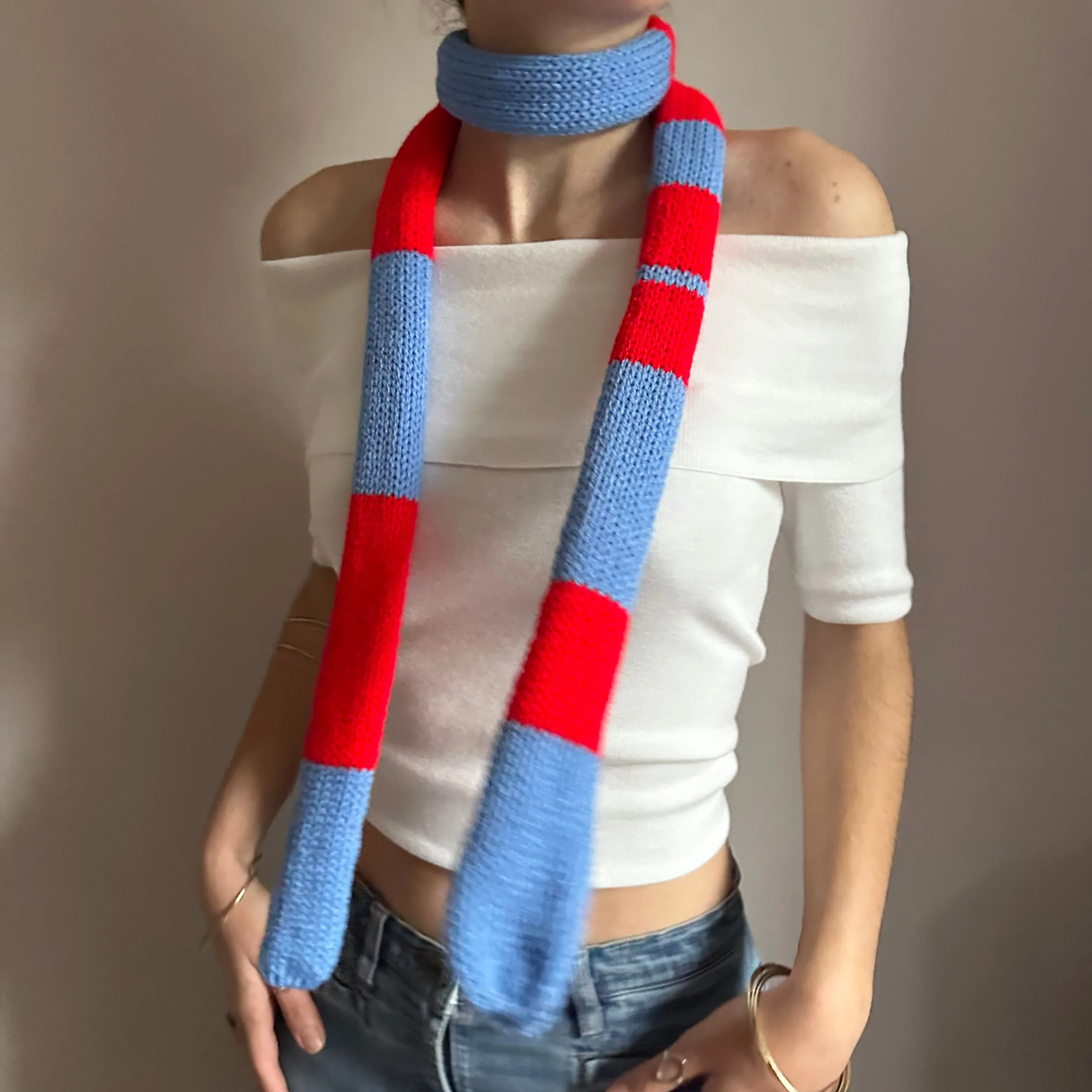 Handmade knitted stripy skinny scarf in red and blue